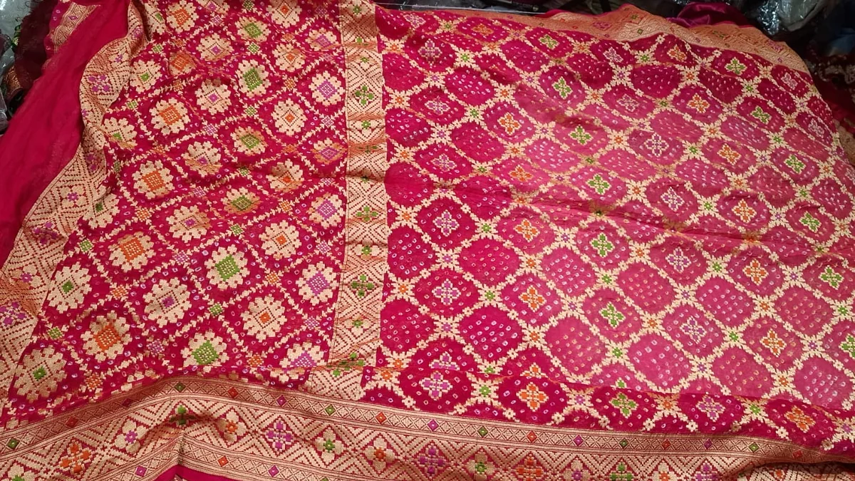 Rani Pink Geometry saree laid flat